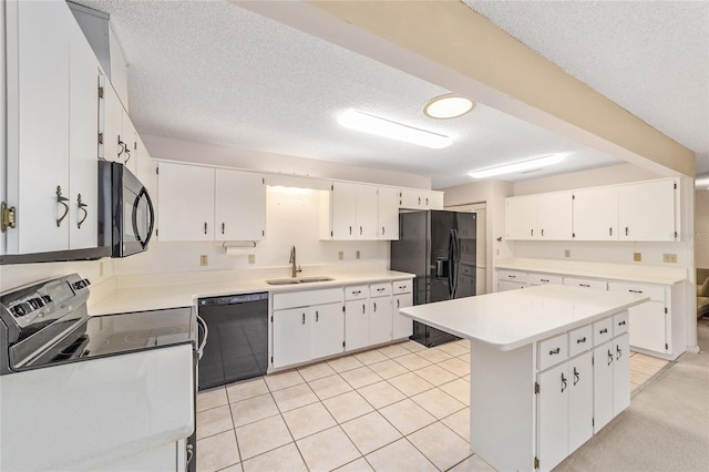 8885 SW 90th Ave, Ocala, FL 34481 - kitchen with black appliances, a sink, a textured ceiling, white cabinetry, and light countertops