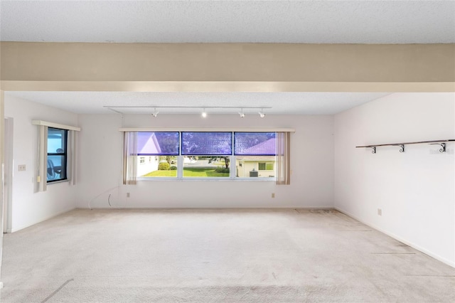 8885 SW 90th Ave, Ocala, FL 34481 - carpeted spare room featuring track lighting