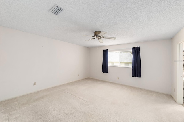 8885 SW 90th Ave, Ocala, FL 34481 - unfurnished room with light carpet, a ceiling fan, and a textured ceiling