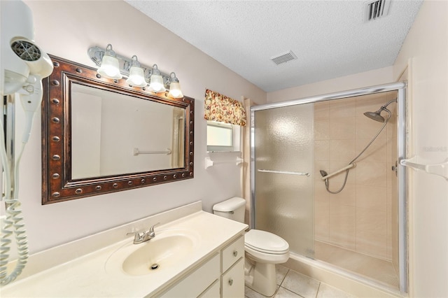 8885 SW 90th Ave, Ocala, FL 34481 - full bath featuring a shower stall, vanity, toilet, a textured ceiling, and tile patterned floors