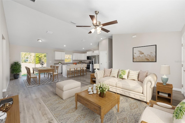 10158 N Carib Way, Citrus Springs, FL 34434 - living area with lofted ceiling, ceiling fan, and light wood finished floors