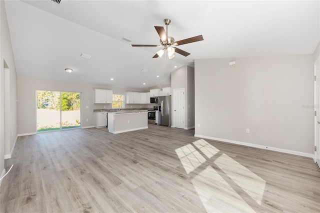10158 N Carib Way, Citrus Springs, FL 34434 - unfurnished living room with ceiling fan, light wood finished floors, high vaulted ceiling, and recessed lighting