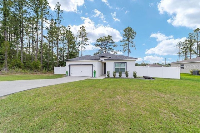 7479 SW 130th Ln, Ocala, FL 34473 - view of front of house with driveway, stucco siding, and an attached garage