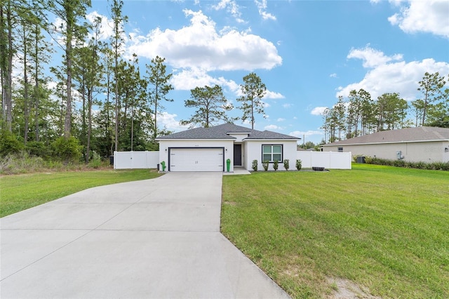 7479 SW 130th Ln, Ocala, FL 34473 - view of front facade featuring driveway, an attached garage, and stucco siding
