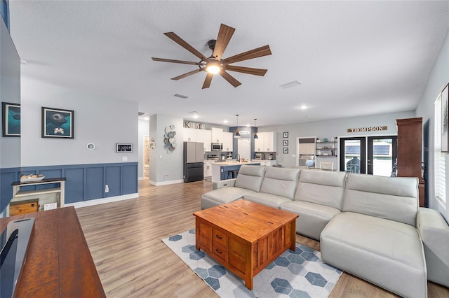 7479 SW 130th Ln, Ocala, FL 34473 - living room featuring a ceiling fan, light wood-style floors, baseboards, and recessed lighting