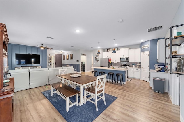 7479 SW 130th Ln, Ocala, FL 34473 - dining room with light wood-style floors, a ceiling fan, and recessed lighting