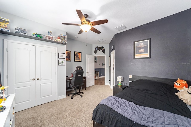 7479 SW 130th Ln, Ocala, FL 34473 - carpeted bedroom with a desk, a closet, ceiling fan, and baseboards