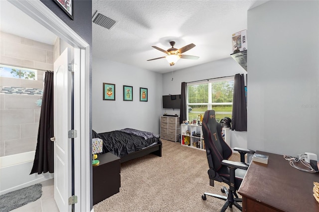 7479 SW 130th Ln, Ocala, FL 34473 - carpeted bedroom featuring a desk, ceiling fan, and a textured ceiling