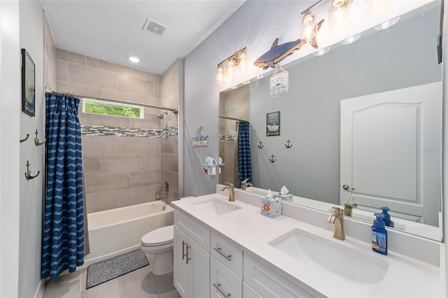 7479 SW 130th Ln, Ocala, FL 34473 - full bath featuring double vanity, toilet, shower / bath combo with shower curtain, and tile patterned floors