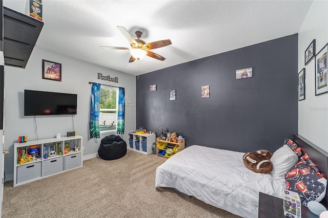 7479 SW 130th Ln, Ocala, FL 34473 - carpeted bedroom with a ceiling fan, a textured ceiling, and baseboards
