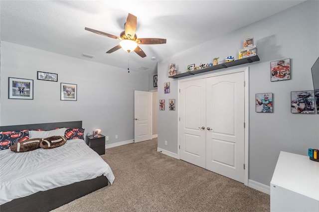 7479 SW 130th Ln, Ocala, FL 34473 - carpeted bedroom featuring baseboards, a closet, and ceiling fan