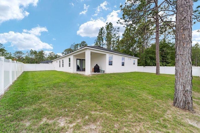 7479 SW 130th Ln, Ocala, FL 34473 - rear view of house with stucco siding