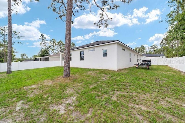7479 SW 130th Ln, Ocala, FL 34473 - back of house featuring stucco siding