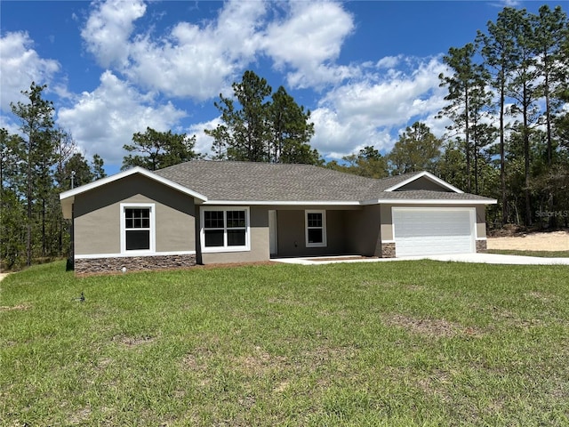 12505 SW 73rd St, Ocala, FL 34481 - ranch-style house with stone siding, stucco siding, a garage, a front lawn, and driveway