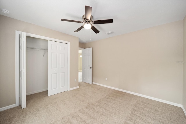 12505 SW 73rd St, Ocala, FL 34481 - unfurnished bedroom featuring light carpet, a closet, baseboards, and ceiling fan