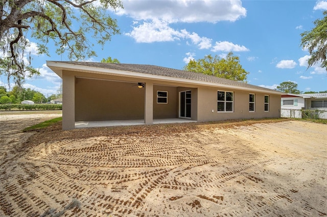 12505 SW 73rd St, Ocala, FL 34481 - rear view of house featuring stucco siding, a patio, and a ceiling fan