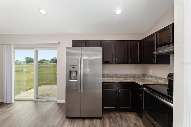 6561 SW 129th Loop, Ocala, FL 34473 - kitchen with appliances with stainless steel finishes, under cabinet range hood, wood finished floors, dark brown cabinetry, and baseboards