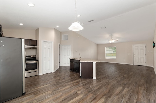 6561 SW 129th Loop, Ocala, FL 34473 - kitchen featuring appliances with stainless steel finishes, under cabinet range hood, lofted ceiling, a sink, and open floor plan