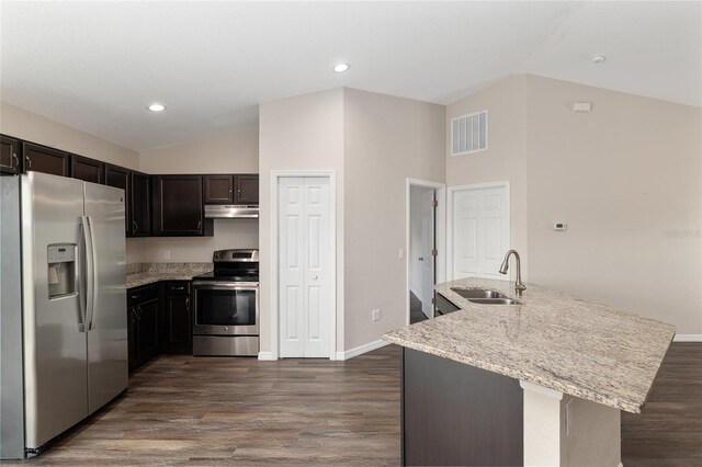 6561 SW 129th Loop, Ocala, FL 34473 - kitchen featuring appliances with stainless steel finishes, a sink, under cabinet range hood, vaulted ceiling, and dark wood-style floors