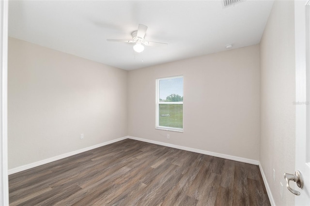 6561 SW 129th Loop, Ocala, FL 34473 - empty room with dark wood-type flooring, a ceiling fan, baseboards, and a smoke detector