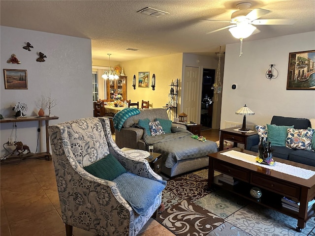 27 Cedar Tree Ter, Ocala, FL 34472 - tiled living area featuring a chandelier, a ceiling fan, and a textured ceiling