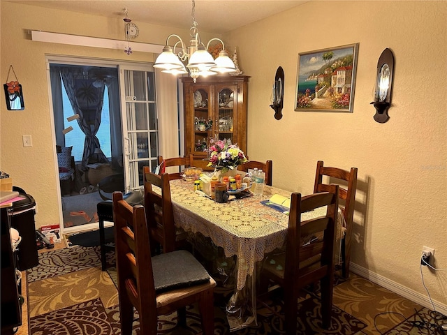 27 Cedar Tree Ter, Ocala, FL 34472 - dining area with a chandelier, a textured wall, and baseboards
