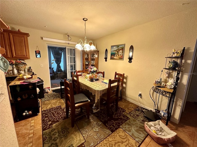27 Cedar Tree Ter, Ocala, FL 34472 - dining area featuring a chandelier, a textured ceiling, a textured wall, and baseboards