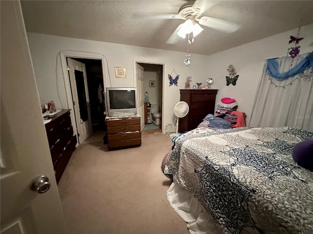 27 Cedar Tree Ter, Ocala, FL 34472 - bedroom with light carpet, a ceiling fan, and a textured ceiling