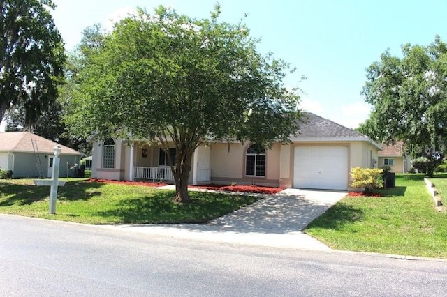 5110 NW 19th Pl, Ocala, FL 34482 - view of front of property featuring a garage, stucco siding, a front lawn, and driveway