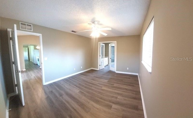 5110 NW 19th Pl, Ocala, FL 34482 - empty room featuring dark wood-style flooring, a ceiling fan, baseboards, and a textured ceiling