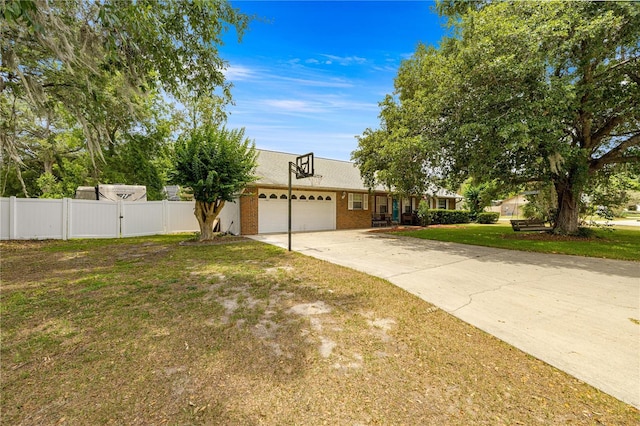 6070 SE 39th Ave, Ocala, FL 34480 - view of front of property with a garage, concrete driveway, a gate, and brick siding