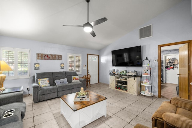6070 SE 39th Ave, Ocala, FL 34480 - living area with vaulted ceiling, light tile patterned floors, and ceiling fan