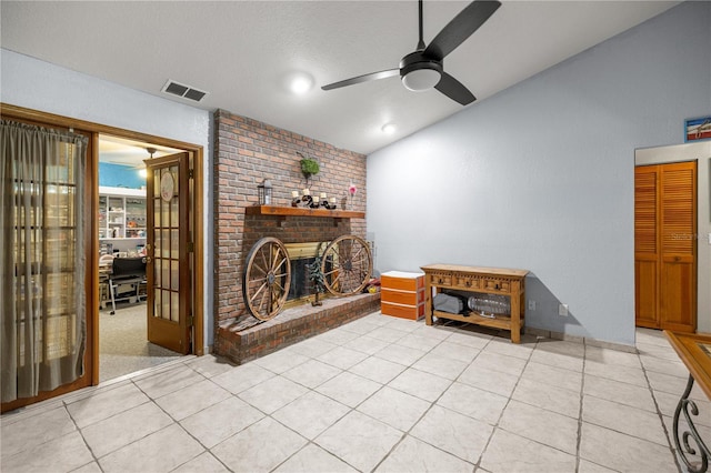 6070 SE 39th Ave, Ocala, FL 34480 - living area featuring lofted ceiling, a ceiling fan, a fireplace, and light tile patterned floors