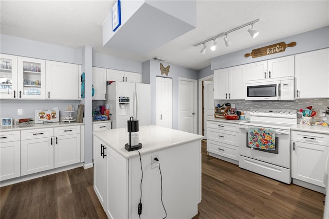 6070 SE 39th Ave, Ocala, FL 34480 - kitchen with white appliances, dark wood-style floors, light countertops, and white cabinetry