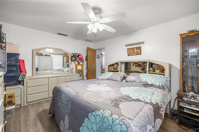 6070 SE 39th Ave, Ocala, FL 34480 - bedroom featuring wood finished floors and a ceiling fan