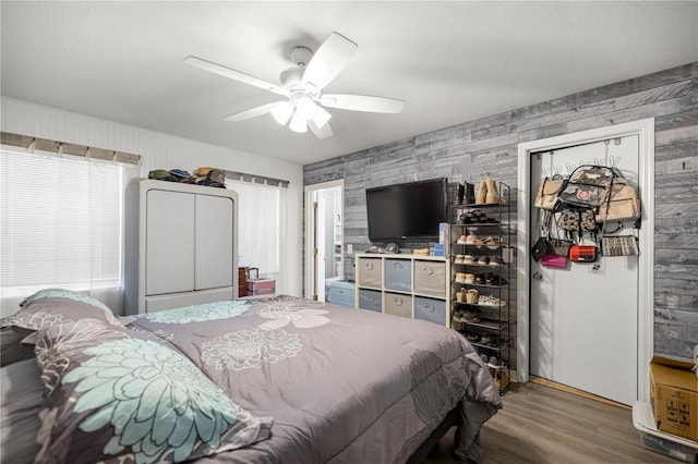 6070 SE 39th Ave, Ocala, FL 34480 - bedroom featuring wallpapered walls, wood finished floors, and a ceiling fan