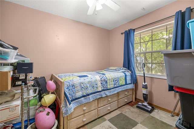6070 SE 39th Ave, Ocala, FL 34480 - bedroom with multiple windows, baseboards, a ceiling fan, and tile patterned floors