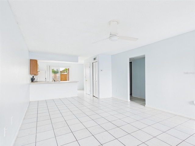 1801 Caralee Blvd Unit 2, Orlando, FL 32822 - empty room with a ceiling fan, light tile patterned floors, and baseboards