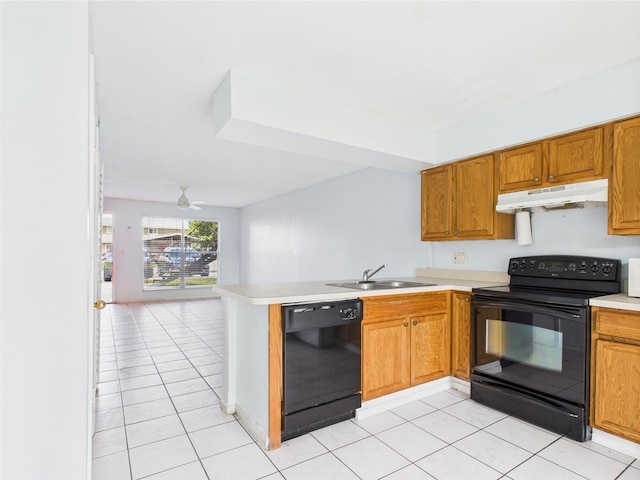 1801 Caralee Blvd Unit 2, Orlando, FL 32822 - kitchen featuring black appliances, under cabinet range hood, a sink, light countertops, and a peninsula