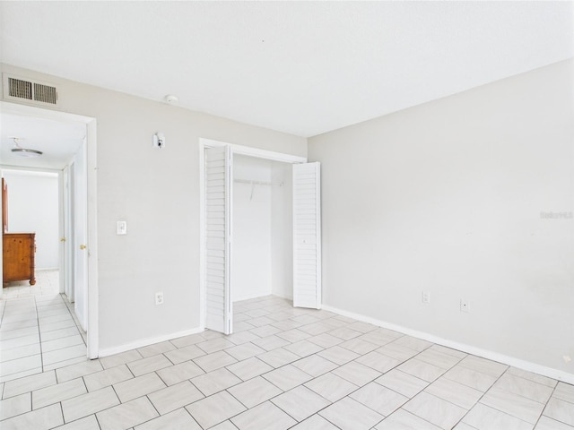 1801 Caralee Blvd Unit 2, Orlando, FL 32822 - unfurnished bedroom with a closet, baseboards, and light tile patterned floors