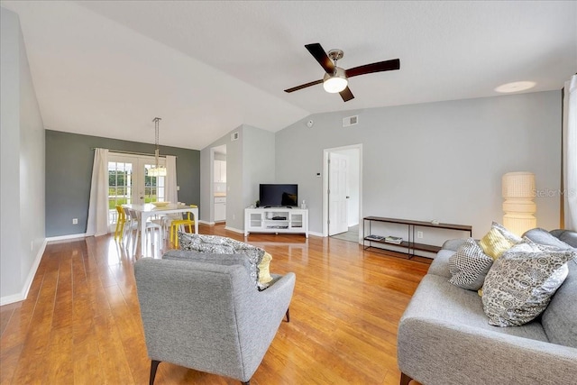 6350 NW 135th Ave, Morriston, FL 32668 - living room with french doors, a ceiling fan, lofted ceiling, light wood-style flooring, and baseboards