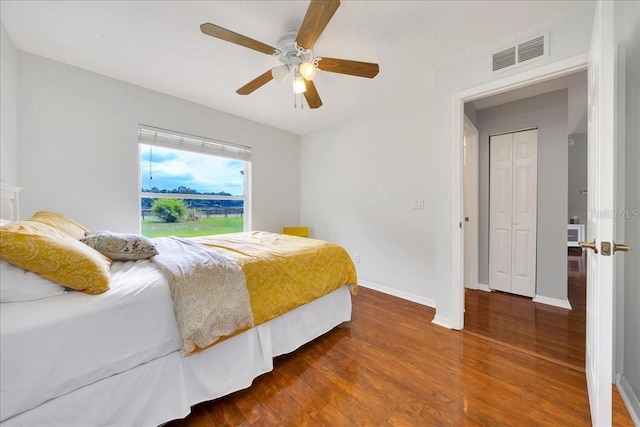 6350 NW 135th Ave, Morriston, FL 32668 - bedroom featuring wood finished floors, baseboards, and ceiling fan