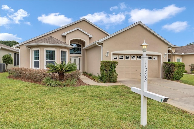 11062 SW 73rd Ct, Ocala, FL 34476 - view of front of property featuring a garage, driveway, and stucco siding