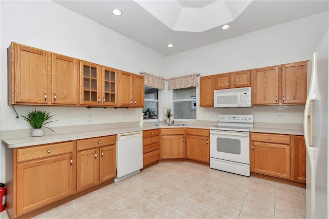 11062 SW 73rd Ct, Ocala, FL 34476 - kitchen featuring white appliances, decorative backsplash, light countertops, light tile patterned floors, and recessed lighting