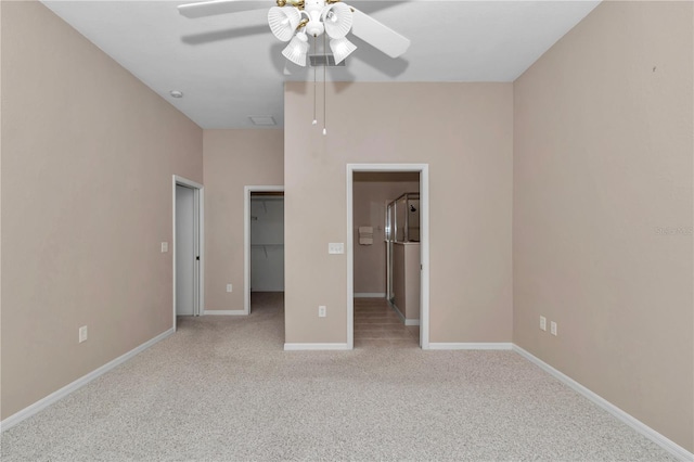 11062 SW 73rd Ct, Ocala, FL 34476 - unfurnished bedroom with light carpet, a spacious closet, baseboards, ceiling fan, and a closet
