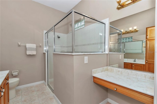 11062 SW 73rd Ct, Ocala, FL 34476 - bathroom with vanity, a shower stall, toilet, tile patterned floors, and baseboards