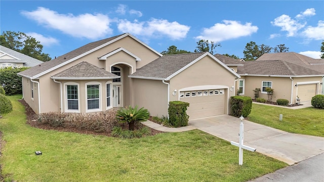 11062 SW 73rd Ct, Ocala, FL 34476 - view of front of house featuring stucco siding, an attached garage, concrete driveway, and a front yard