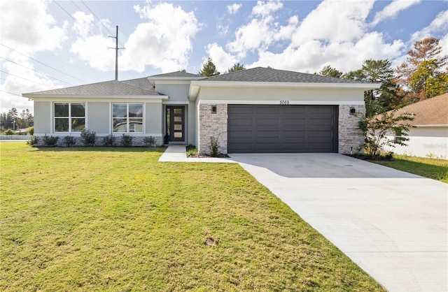 10207 SW 41st Ter W, Ocala, FL 34476 - view of front of house with an attached garage, stucco siding, concrete driveway, and a front lawn