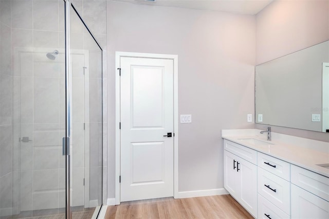10207 SW 41st Ter W, Ocala, FL 34476 - full bath with double vanity, a shower stall, and wood finished floors