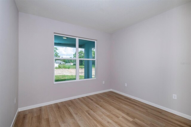 10207 SW 41st Ter W, Ocala, FL 34476 - unfurnished room featuring light wood finished floors and baseboards